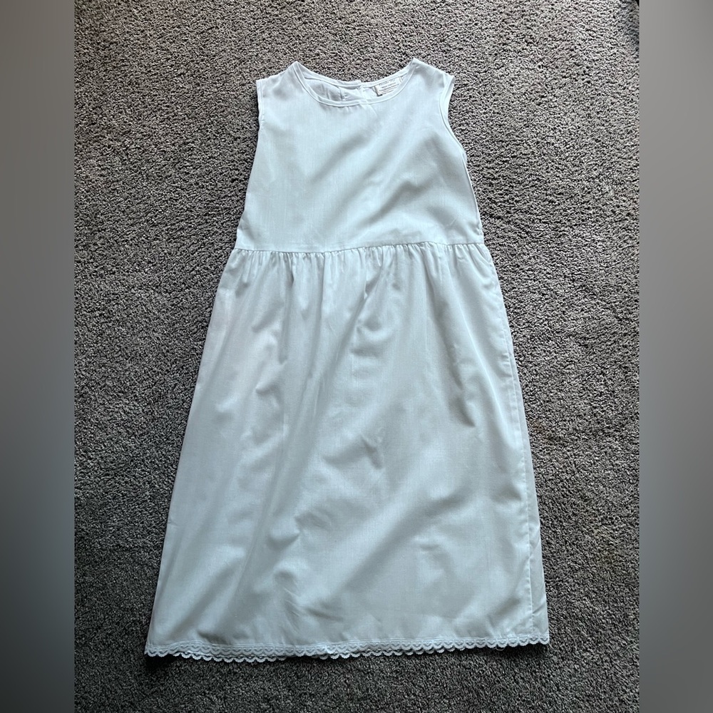 lavender blue slip, new with tags. size 8. white. perfect condition.
